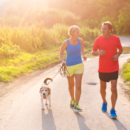 Couple jogging with dog